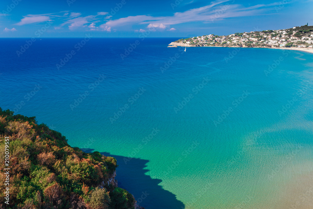 Panoramic sea landscape with Gaeta, Lazio, Italy. Scenic historical town with old buildings, ancient churches, nice sand beach and clear blue water. Famous tourist destination in Riviera de Ulisse Panoramic sea landscape with Gaeta, Lazio, Italy. Scenic historical town with old buildings, ancient churches, nice sand beach and clear blue water. Famous tourist destination in Riviera de Ulisse