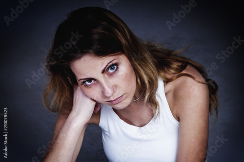 Portrait of stressed and depressed woman (frustration, anxiety, worries, problems concept)