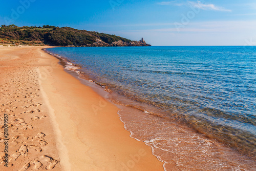 Panoramic sea beach landscape near Gaeta, Lazio, Italy. Nice sand beach and clear blue water. Famous tourist destination in Riviera de Ulisse. Bright sunny light and sunset. photo