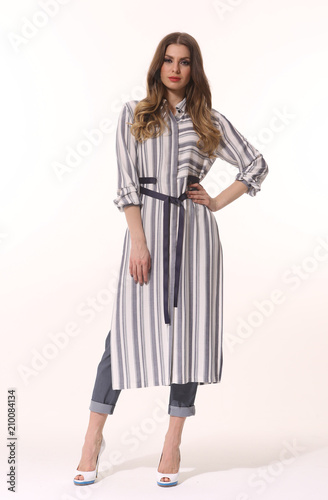 young caucasian business woman executive posing in summer sleeveless dress high heels stiletto shoes full body length isolated on white