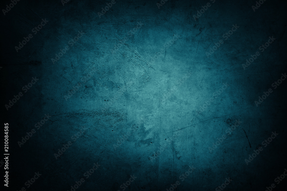 Blue textured concrete wall background. Dark edges