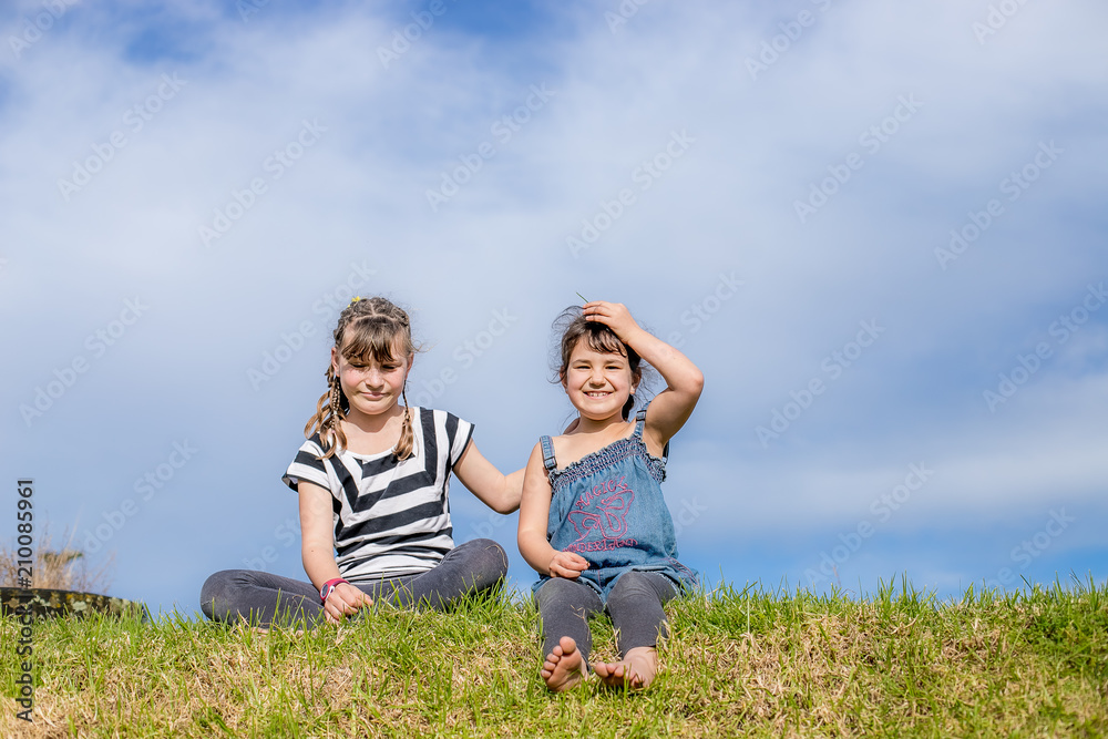 outdoor portrait of young happy child girl having fun on natural background