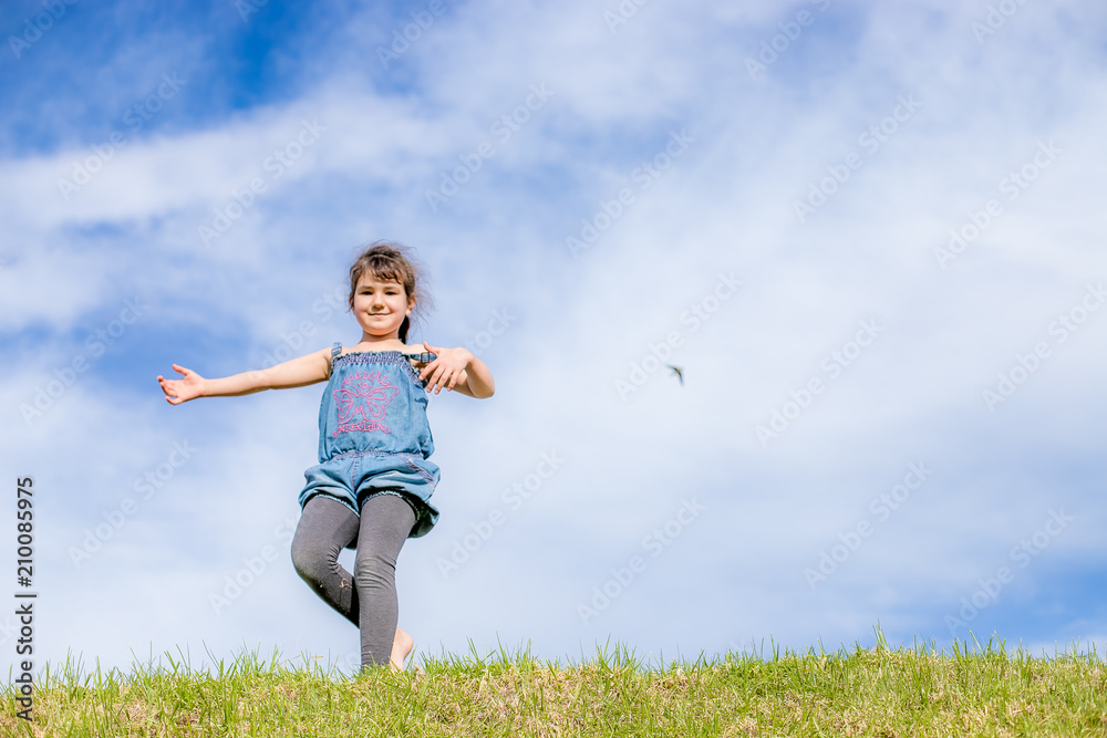 outdoor portrait of young happy child girl having fun on natural background outdoor portrait of young happy child girl having fun on natural background