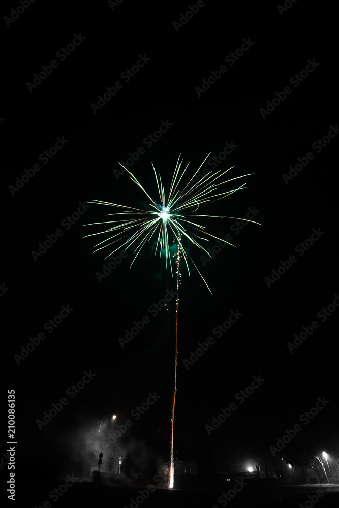 Colorful fireworks on black background, celebration of the New Year