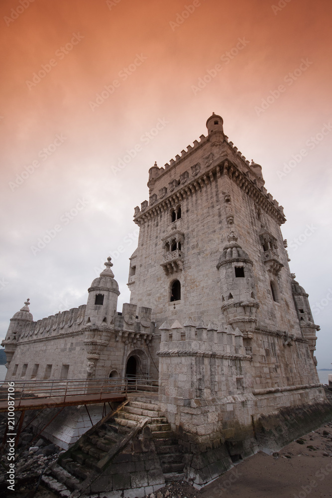 belem tower portugal medieval building perspective red sky