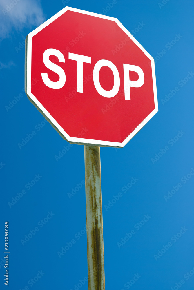 Stop sign blue sky background
