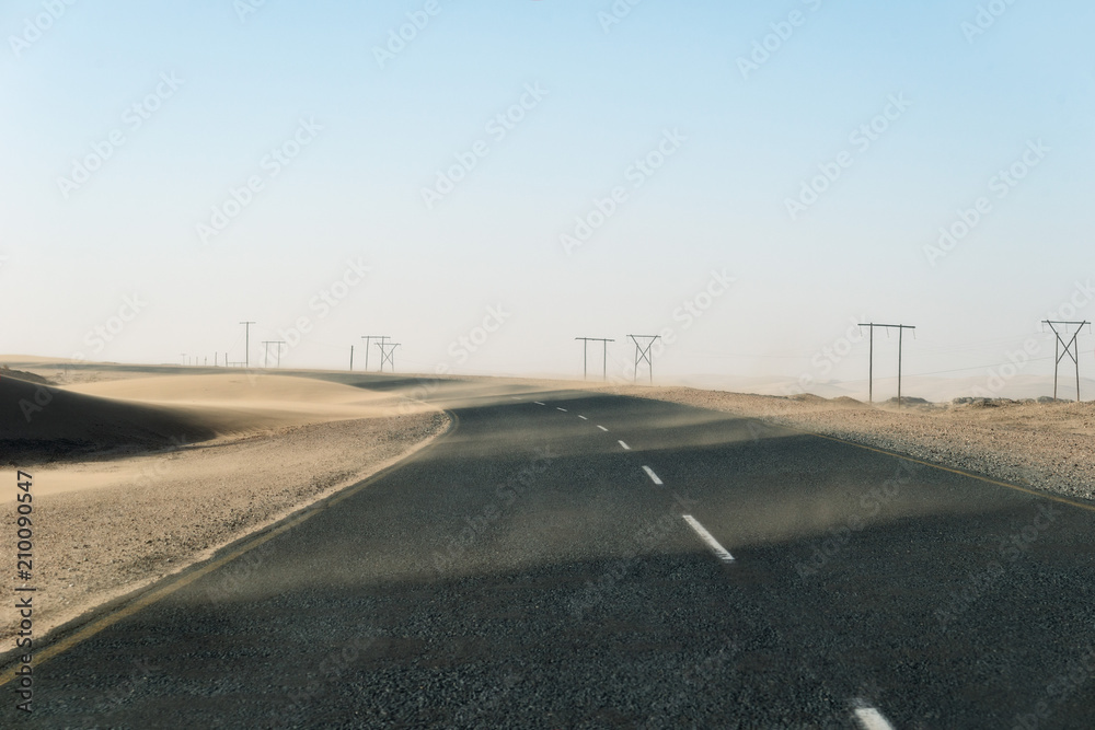 Sand Storm Across Lonely Desert Road in Southern Namibia taken in January 2018 Sand Storm Across Lonely Desert Road in Southern Namibia taken in January 2018