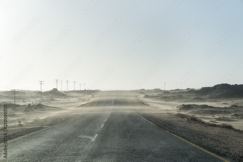 Fototapeta premium Sand Storm Across Lonely Desert Road in Southern Namibia taken in January 2018