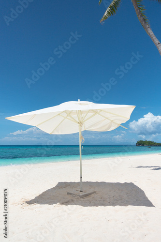 White Beach Umbrella Providing Shade During Tropical Vacation - Bohol  Philippines