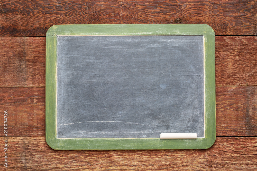 blank slate blackboard against rustic wood blank slate blackboard against rustic wood