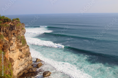 Perfect waves roll in from my cliff overlook in Bali