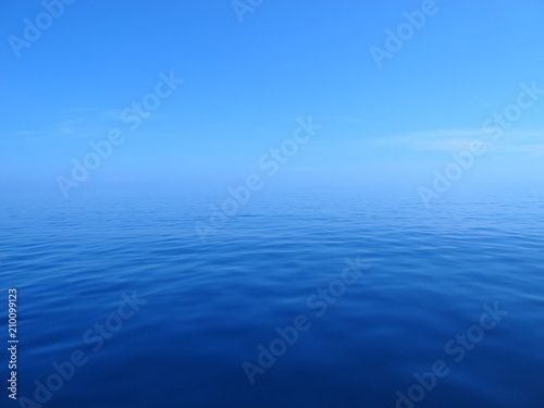 Blue ocean meets blue sky in an endless horizon