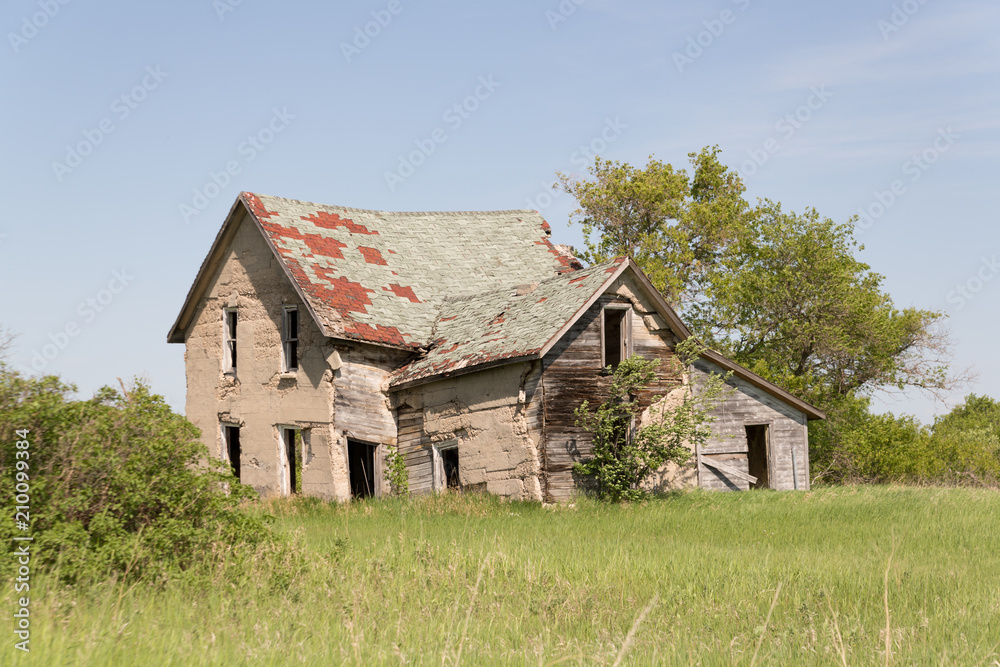 old broken down brick house