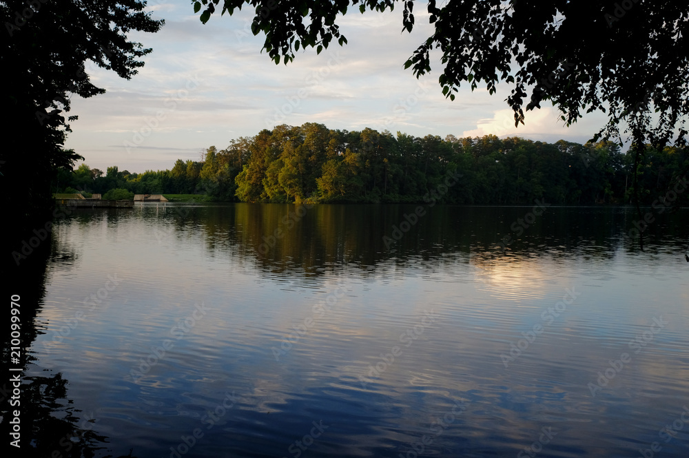 Lake Raleigh early in the morning during summer in Raleigh North Carolina Lake Raleigh early in the morning during summer in Raleigh North Carolina
