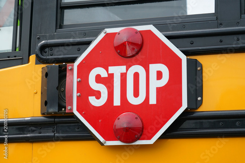 close up on stop sign on the school bus