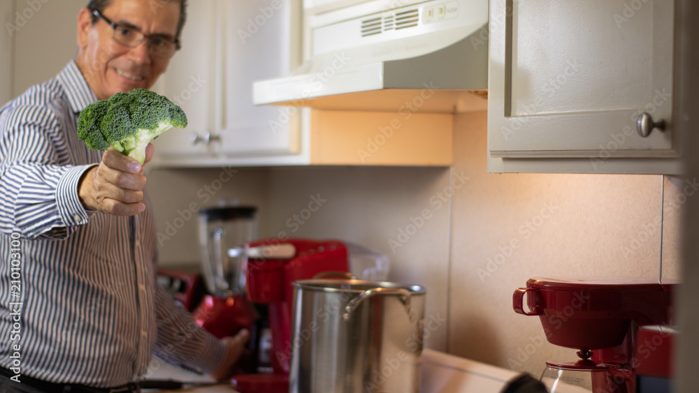 man cooking in the house inside the kitchen man cooking in the house inside the kitchen