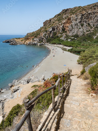 Preveli Beach in Crete island, Greece. There is a palm forest and a river inside the gorge near this beach. June, 2018