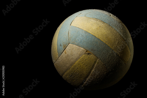 Old Volleyball on Black Background