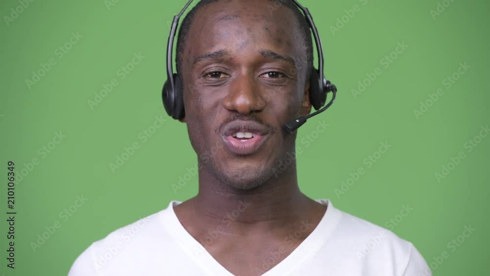 Young African man working as call center representative