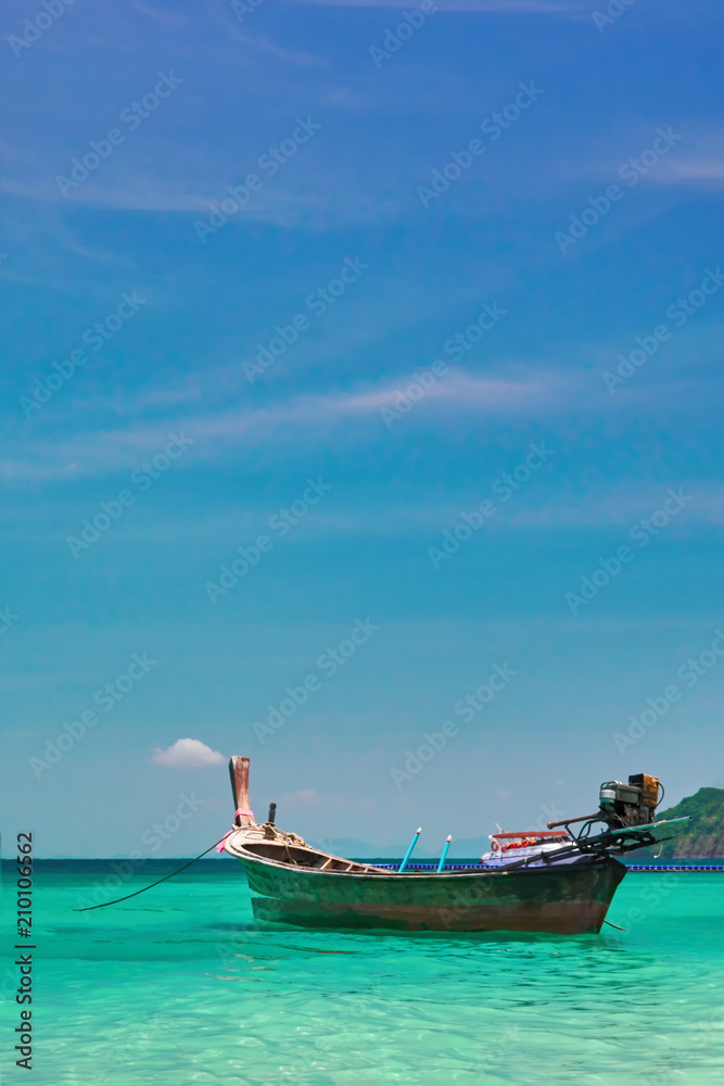 Beautiful seascape with wooden fishing boat. Tropical sea landscape with turquoise water and blue sky. Tropical paradise. Horizon.