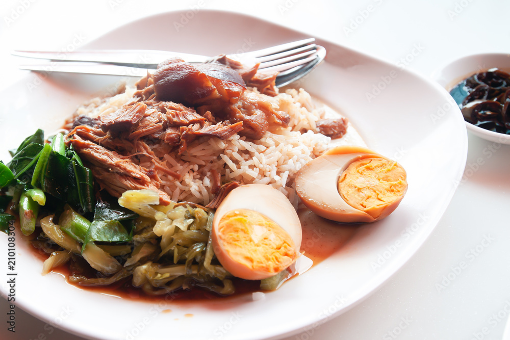 Stewed pork with rice and egg, Chinese-Thai traditional favorite food. Unhealthy food Stewed pork with rice and egg, Chinese-Thai traditional favorite food. Unhealthy food