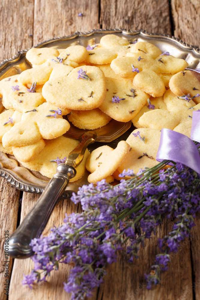 Fototapeta premium Delicious lavender shortbread cookie closeup on a plate. vertical