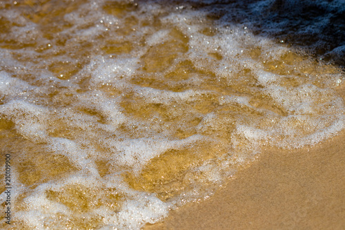 Wave of the sea on the sand beach