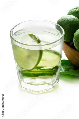 Lemon drink whit lime slices isolated on a white background.