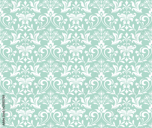 Wallpaper in the style of Baroque. A seamless vector background. White and blue floral ornament. Graphic pattern for fabric, wallpaper, packaging. Ornate Damask flower ornament