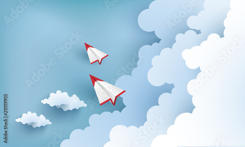 Fototapeta Naklejka Na Ścianę i Meble -  paper airplanes flying across clouds. design paper art and crafts