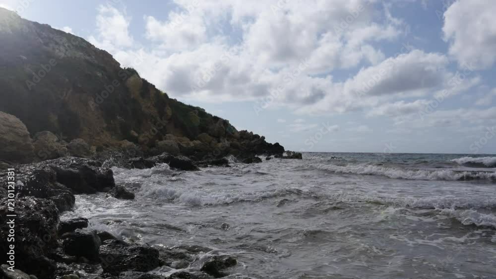 Maltese nature rocks coasline and waves of Mediterranean sea in november Maltese nature rocks coasline and waves of Mediterranean sea in november