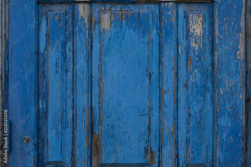 Fragment of blue wooden door. Vintage timber texture background. Rustic view.