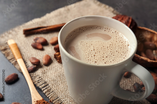 Fototapeta Naklejka Na Ścianę i Meble -  Cup of delicious hot cocoa on grey background, closeup