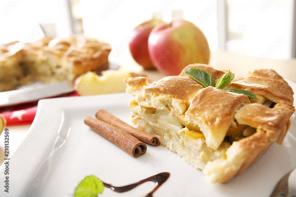 Piece of delicious apple pie on plate, closeup