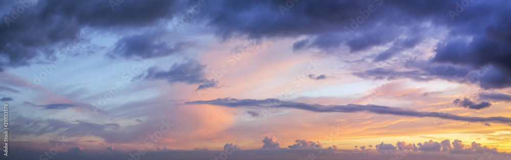 Interesting forms of clouds in the evening at sunset.