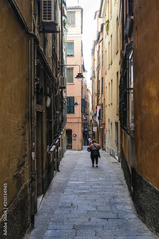 Naklejka premium Genoa, Italy - June, 12, 2018: street in a center of Genoa, Italy
