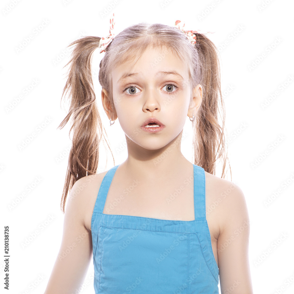 Young Seven Years Old Brunette Girl In Blue Dress On A White Isolated