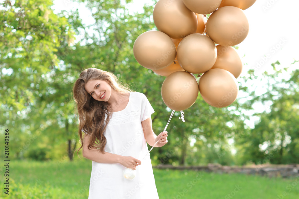 Beautiful young woman with balloons outdoors Beautiful young woman with balloons outdoors