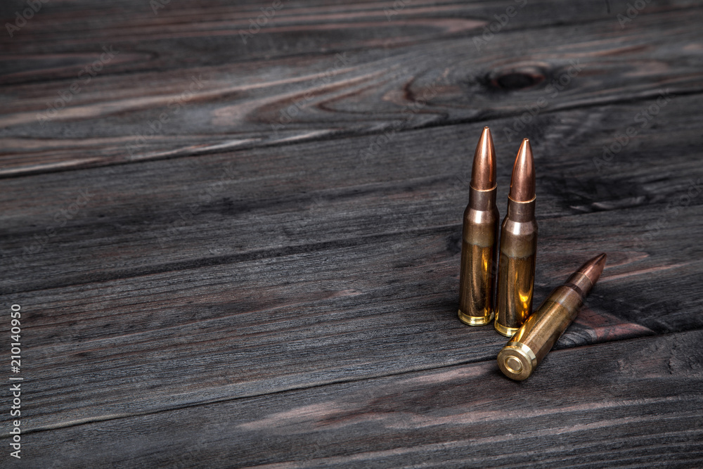 Cartridges on a dark wooden background Cartridges on a dark wooden background