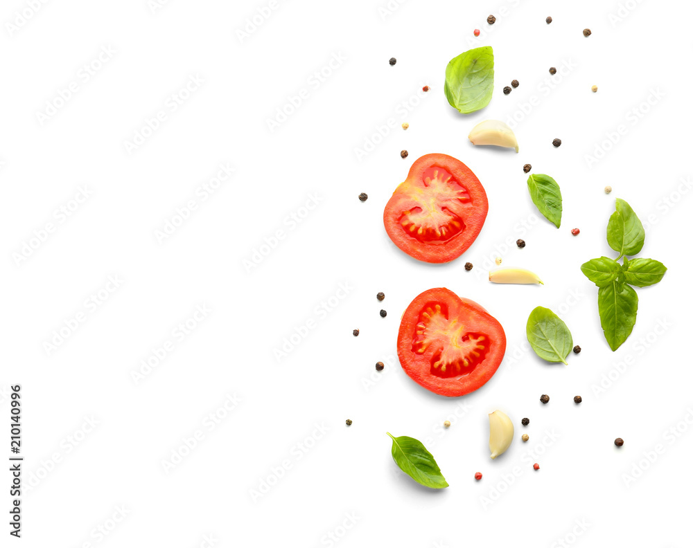 Fototapeta Fresh green basil with tomatoes and spices on white background