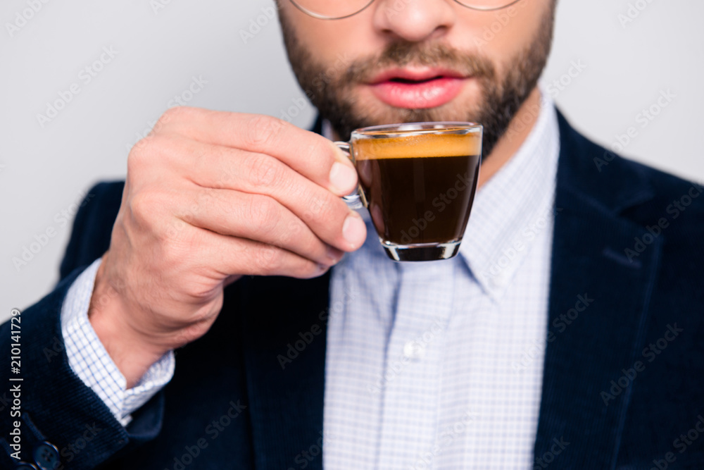 Cropped close up photo of tasty bitter fresh aromatic hot espresso in glass, confident smart wearing formal outfit checkered shirt drinking coffee in the morning at work isolated on gray background Cropped close up photo of tasty bitter fresh aromatic hot espresso in glass, confident smart wearing formal outfit checkered shirt drinking coffee in the morning at work isolated on gray background