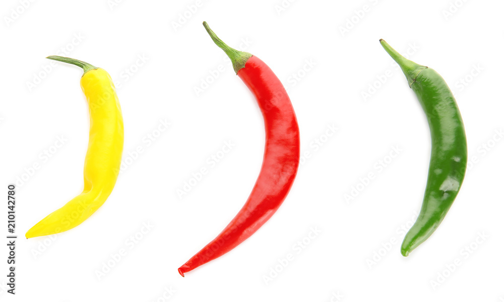 Different chili peppers on white background Different chili peppers on white background