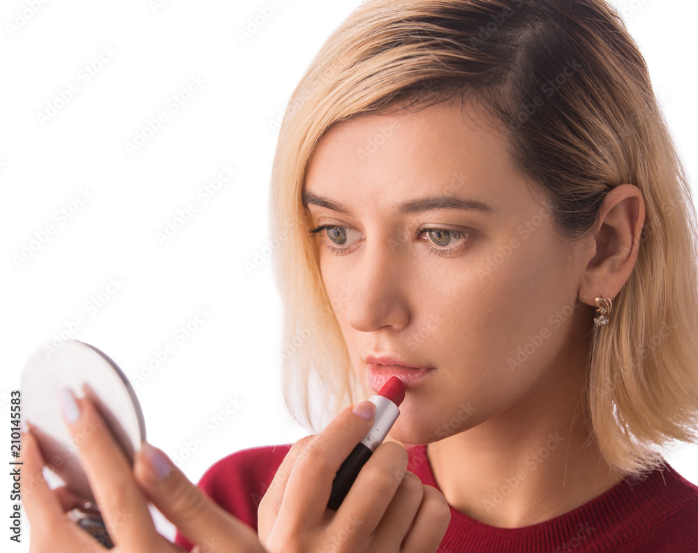 Beautiful young woman with lipstick. Applying make-up Beautiful young woman with lipstick. Applying make-up