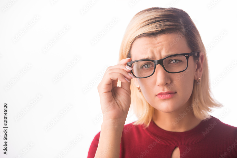 Woman wearing glasses with bad eyesight vision isolated on white