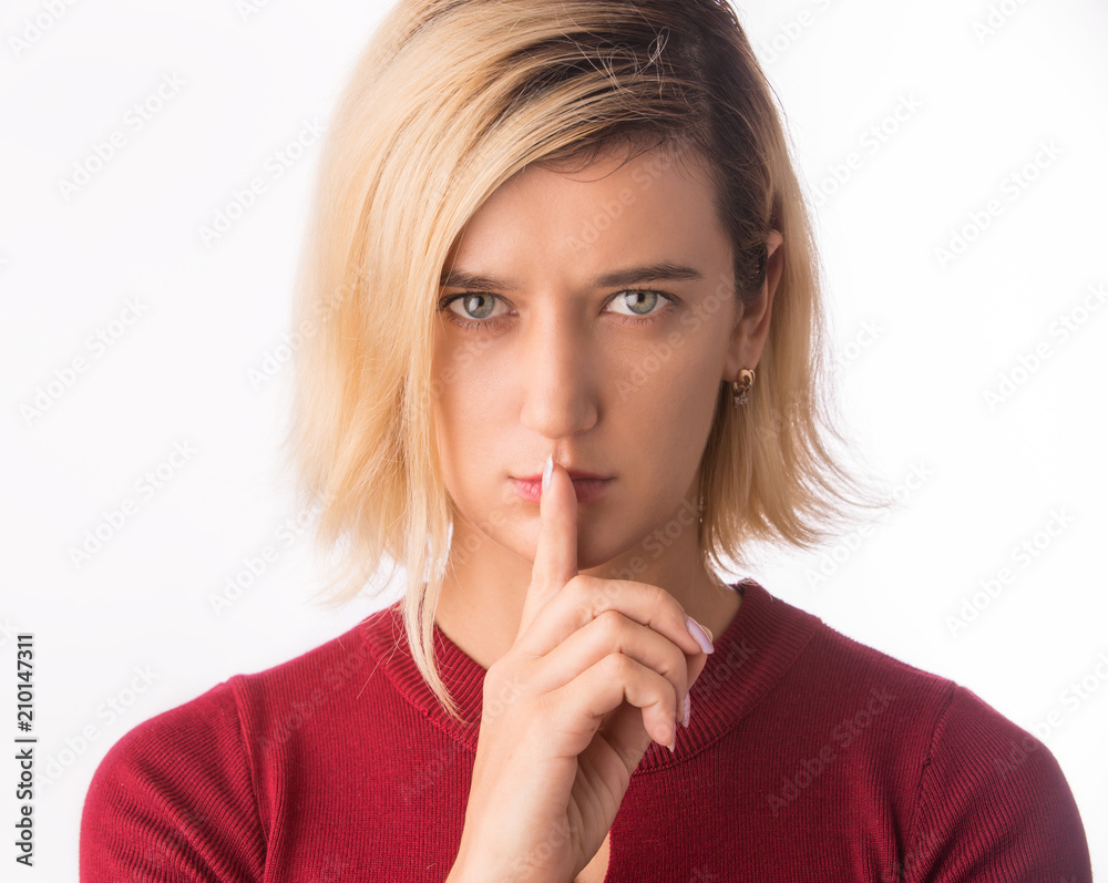 Fingers on lips- girl making silence gesture shh sign Isolated on white Fingers on lips- girl making silence gesture shh sign Isolated on white