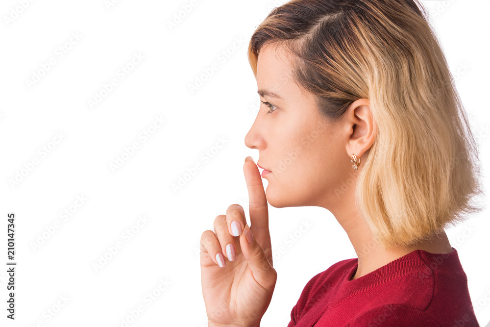 Fingers on lips- girl making silence gesture shh sign Isolated on white Fingers on lips- girl making silence gesture shh sign Isolated on white