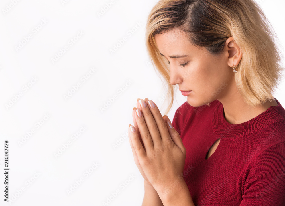 Woman praying with hands together on white Woman praying with hands together on white