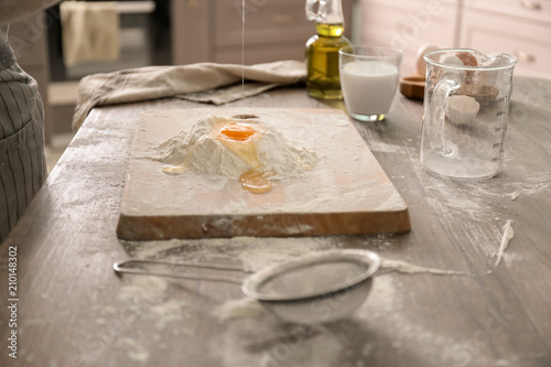 Making of dough for bakery on table in kitchen