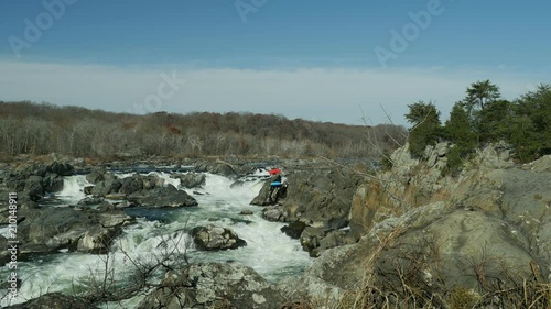 People carrying kayaks at Great Falls of Potomac river