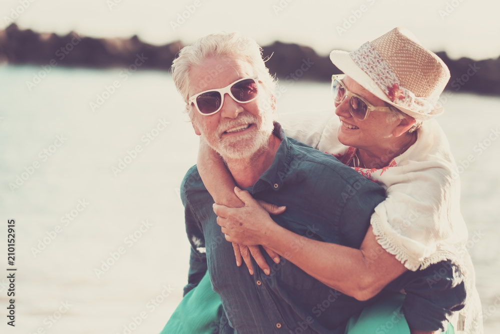 happiness couple caucasian people enjoy and smile the outdoor leisure activity during the summer vacation. love forever together and laughi for male and woan senior adults at the beach.